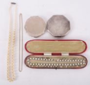 A Victorian Revit paste necklace, in a red leather case, a string of faux pearls,