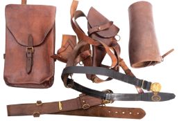 An assortment of military leather items,
