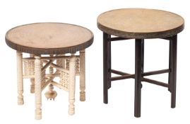 Three near eastern repousse work brass circular tiffin tables on stained or painted wood stands,