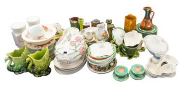 A collection of mainly green glazed pottery items including a set of six vine leaf pattern dessert