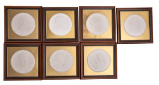 A group of seven embossed paper portrait plaques of Charles Dickens, Edward VII,
