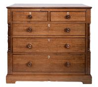 An early 19th Century oak rectangular chest containing two short and three long drawers between