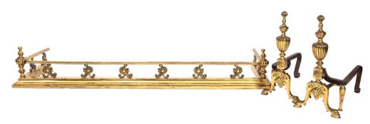 A brass fender, circa 1900, the moulded top rail with lobed urn finials at the corners,
