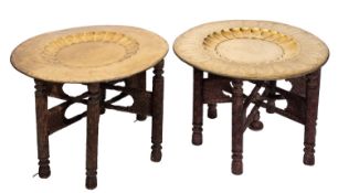 A pair of Middle Eastern brass topped circular tiffin tables, late 19th century,