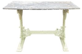 A Victorian cast iron and later painted conservatory table, with a rectangular stone slab top,