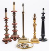 A pair of red and gilt decorated Italianate lamps of triangular section,