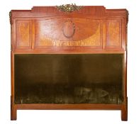 A marquetry and parquetry veneered and gilt metal mounted headboard in Louis XVI style,