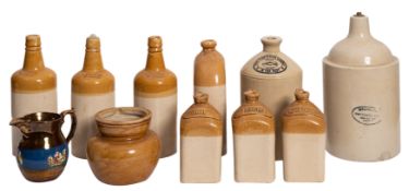 A collection of stoneware casks and flasks including a set of three Bailey Fulham brandy,