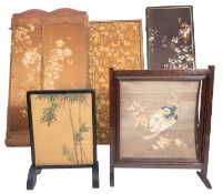 An Edwardian oak firescreen with Japanese silkwork panel of a tied egg and blossoming flowers,