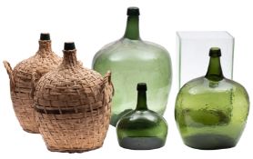 A green glass seal bottle, '25', 50cm high,a pair of oval wicker bound glass flasks,