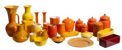 A collection of brightly coloured orange and yellow glazed ceramicwares including a pair of