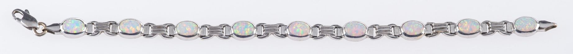 An opal bracelet and matching pendant, t