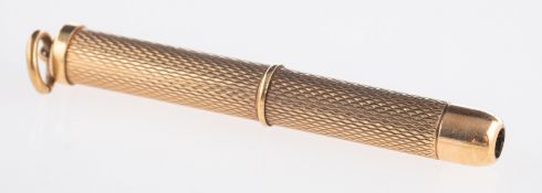A 9ct yellow gold toothpick, with engine