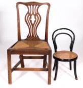 An ebonised bentwood and canework child'