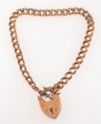 A curb bracelet, with a heart padlock an