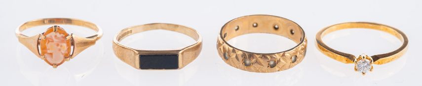 A group of four rings, to include a soli