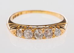 An 18ct yellow gold five stone ring, set