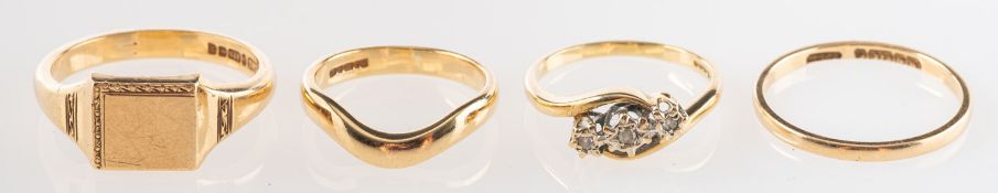 A group of four 9ct gold rings, includin
