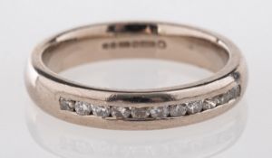 An 18ct white gold half eternity ring, s