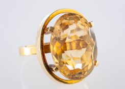 A cocktail style ring, set with an oval