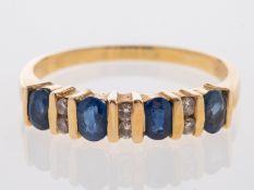 A sapphire and diamond half eternity rin