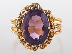 An amethyst ring, set with an oval mixed