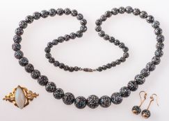 A brooch and a pair of drop earrings, an