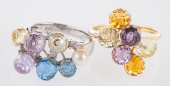 Two briolette set rings, a ring set with