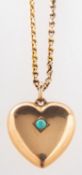 A pendant and chain, a heart shaped pend