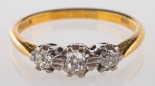 An 18ct gold three stone ring, set with