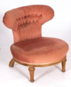 An Edwardian oak, beech and pink fabric