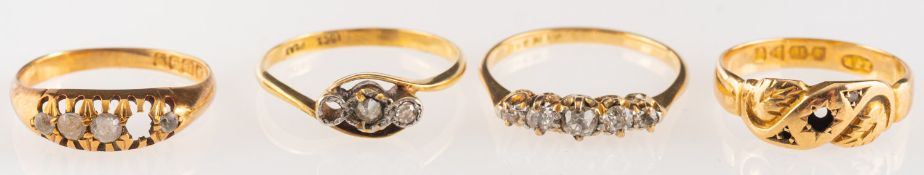 A group of four rings, including a ring