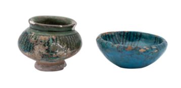A small early Persian turquoise-glazed bowl and a green-glazed jar both with black painted
