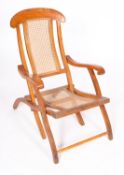 A teak and canework folding 'planter's chair',