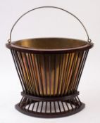 A Continental mahogany and brass kettle stand, of navette form,