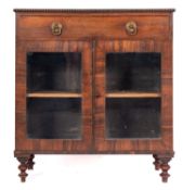 A Regency rosewood side cabinet, early 19th century; the top with bobbin-turned edging,