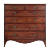 A late George III or Regency mahogany chest of drawers,
