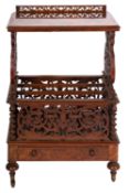 A Victorian walnut Canterbury whatnot, circa 1870; the top with openwork back gallery,
