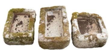 Three rough hewn granite troughs or planters,