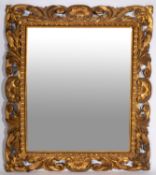 A carved and giltwood framed rectangular wall mirror in Florentine 18th century style,