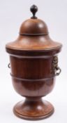 A matched pair of George III mahogany urn cellarets,