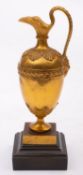 A Louis Philippe gilt bronze model of a ewer, circa 1840; of ovoid form with flared spout,