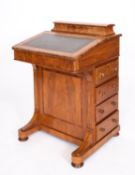 A Victorian walnut and crossbanded Davenport, by George Davis of Plymouth,