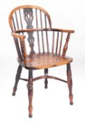 A Regency elm and yew wood Windsor elbow chair,