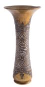 An Ottoman brass and silver inlaid trumpet vase decorated with three panels of Islamic script on a