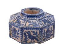 A Spanish Talavera blue and white faience octagonal inkwell painted with panels of birds and floral