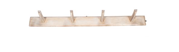 A painted pine wall mounting saddle rack,