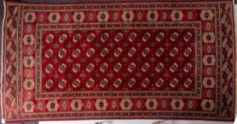 A Turkoman carpet, the wine field with four rows of quartered guls,