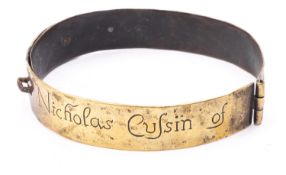 A brass dog collar dated 1692 engraved 'Nicholas Cussin of Yate, 'house owner 1692',15cm.
