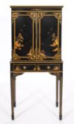 A black lacquered and parcel gilt chest on stand, in early 18th century taste,